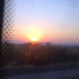 En route Mumbai from Pune. Sunset as witnessed from a dirty window of an otherwise spotless, airconditioned Shivneri.